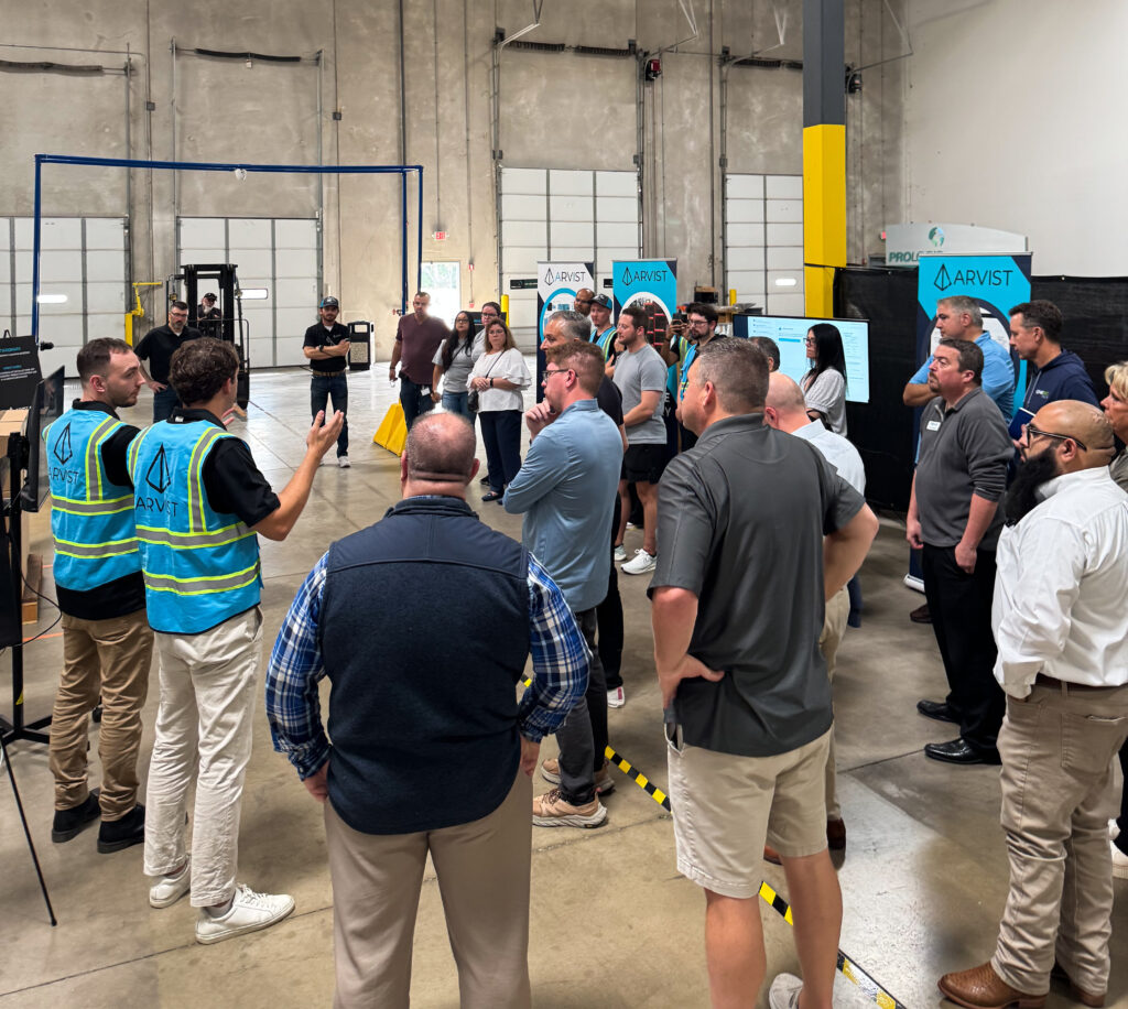 Arvist Experience Center hands-on demo showing AI warehouse quality control stations in action